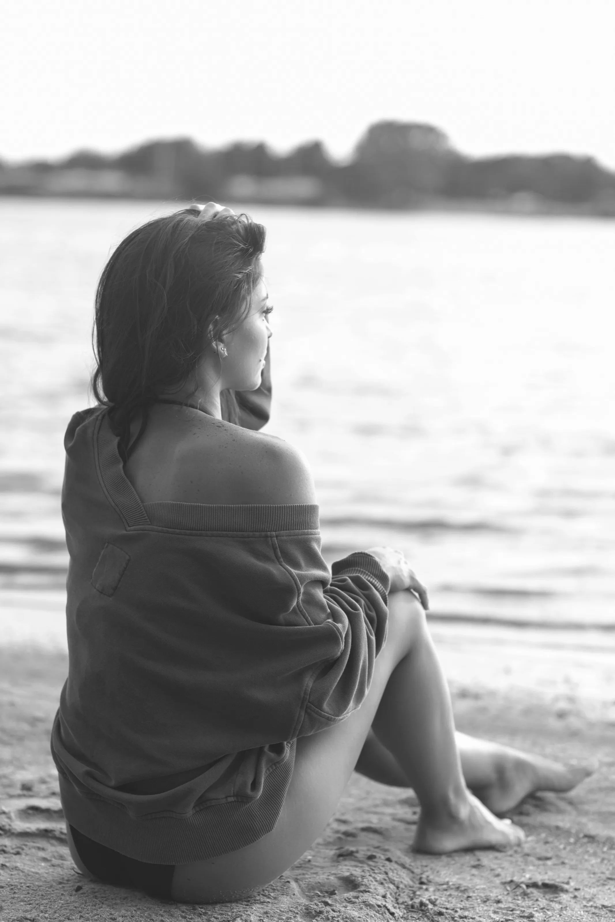 Black-and-white profile portrait looking over the water